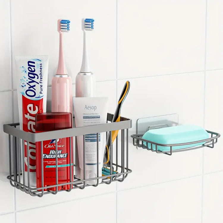 Bathroom shelf with toothbrushes, toothpaste, and soap on a tiled wall
