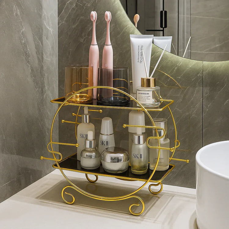 Gold decorative shelf with skincare products and toothbrushes on a bathroom counter.