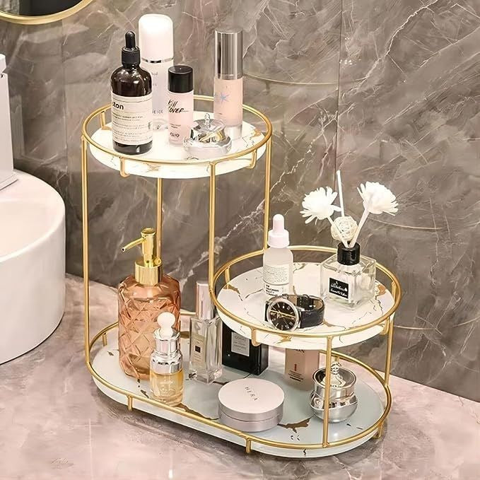 Front view of 3 layer acrylic makeup organizer with gold metal frame in Pakistan

