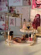 Makeup and perfume set on a decorative stand with a stylish background