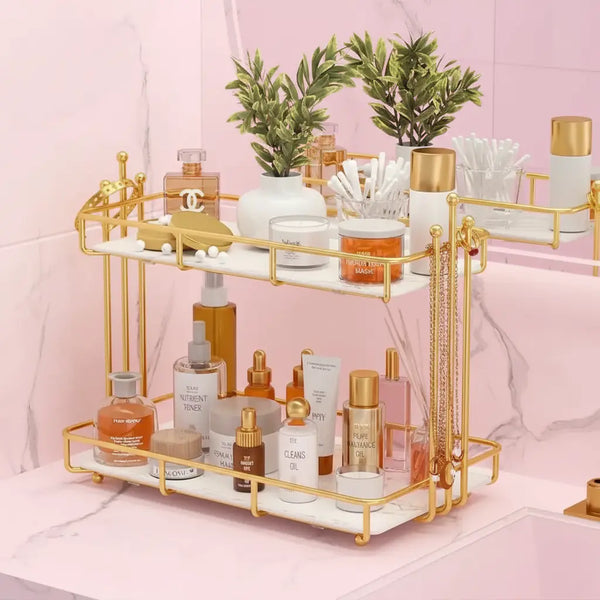 Gold and white decorative shelf with skincare products on a pink background