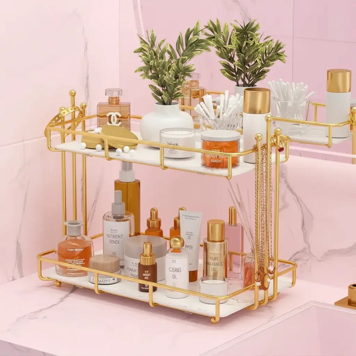 Gold and white decorative shelf with skincare products on a pink background