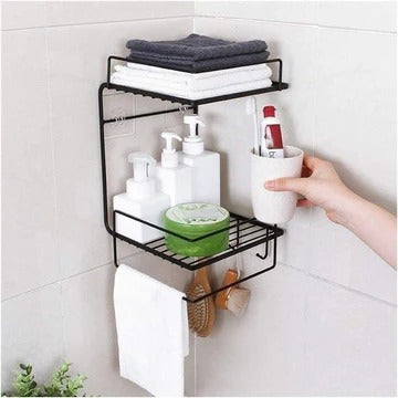 Black corner shelf with bathroom items on a tiled wall