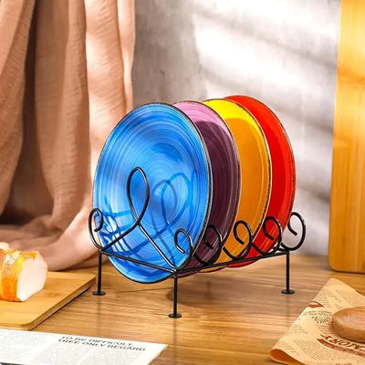 Set of colorful plates on a decorative stand with a blurred background