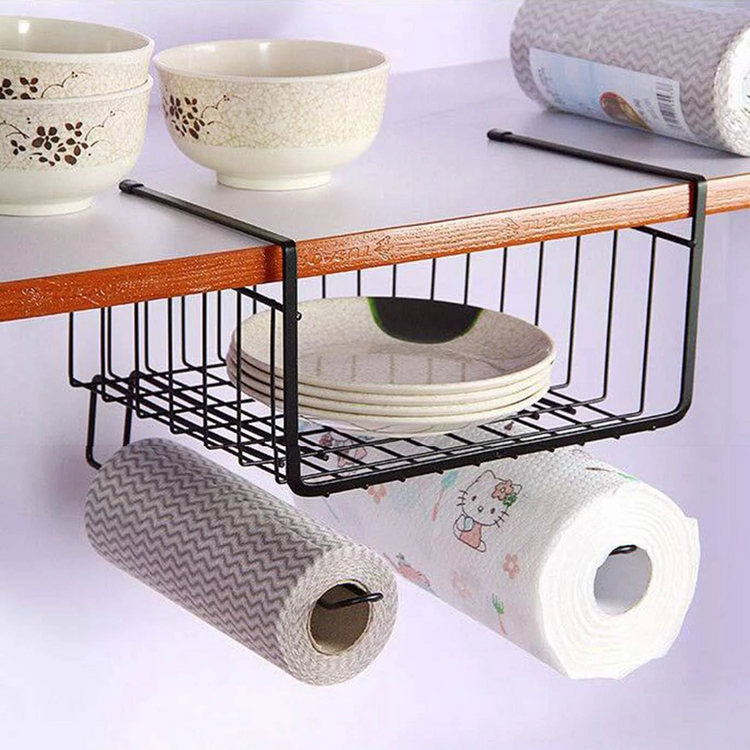 Kitchen storage solution with a black metal shelf holding plates, bowls, and paper towels on a white background.