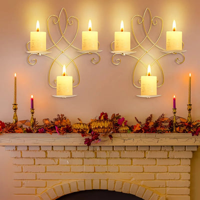 Decorative candles on a fireplace mantle with decorative elements.