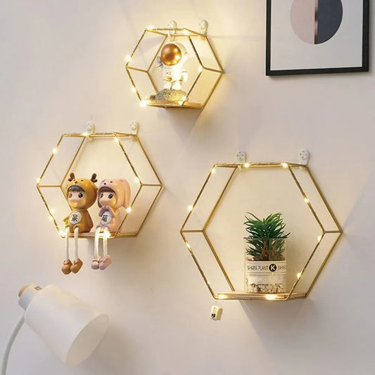 Hexagon floating wall shelves with gold metal frame and wooden base for modern home decor in Pakistan by Dukaanwali

